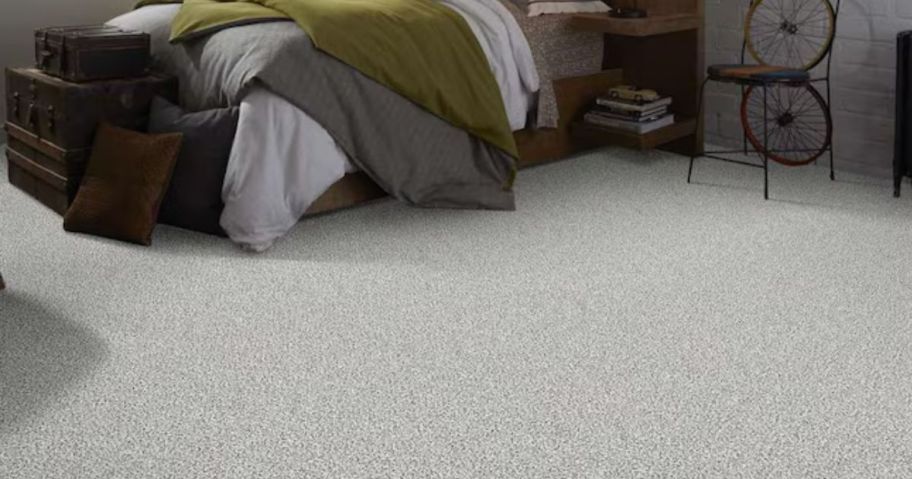 A gray carpet in a bedroom