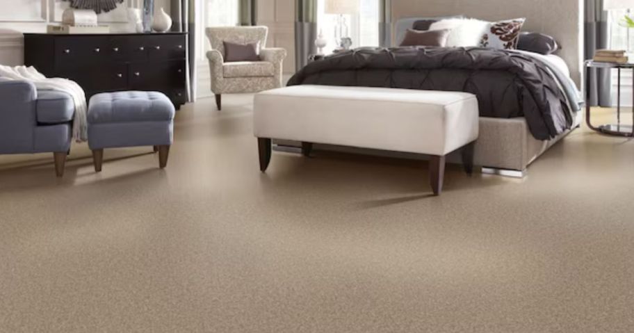 A brown carpet in a bedroom