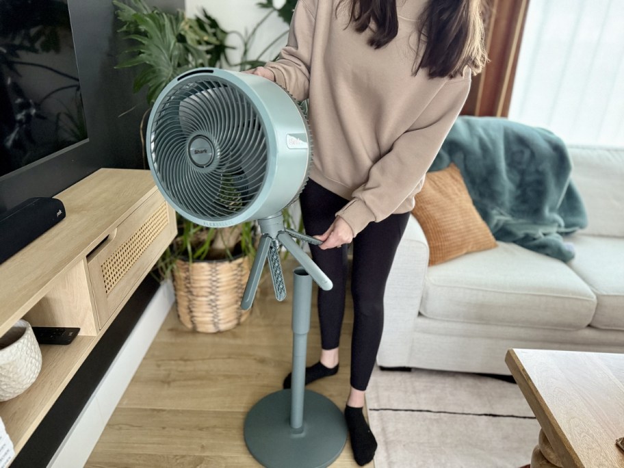 Shark FlexBreeze Cordless Fan w/ Car Charger in blue being converted into tabletop mode