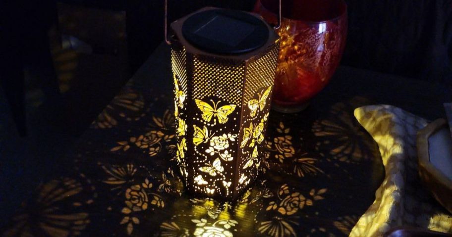 A butterfly solar lantern glowing in the dark