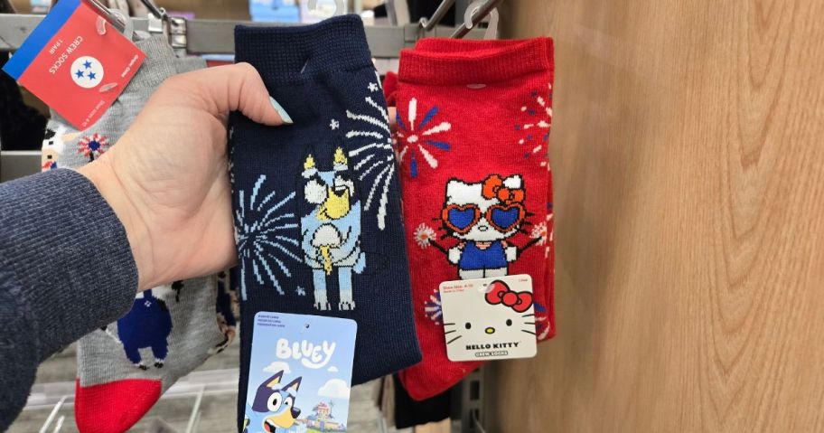 A person showing 4th of July socks at Target