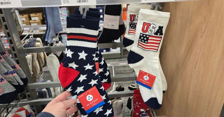 A person showing 4th of July socks at Target