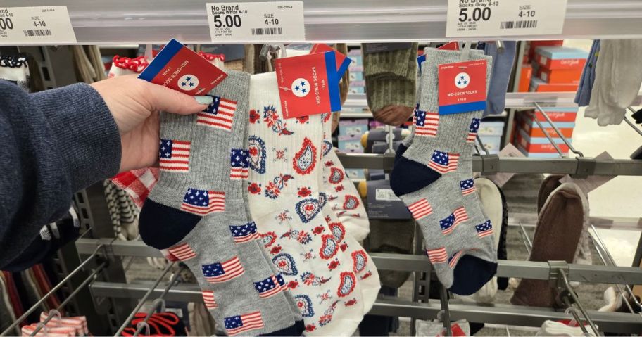 A person showing 4th of July socks at Target