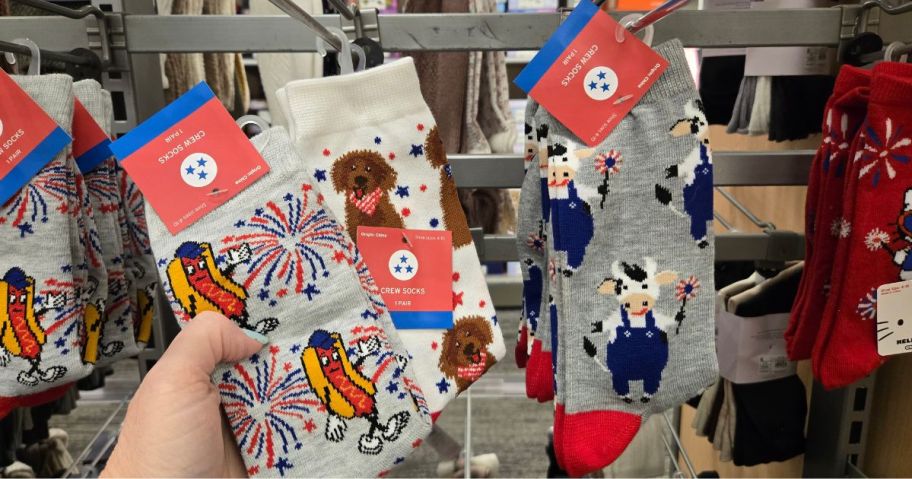A person showing 4th of July socks at Target