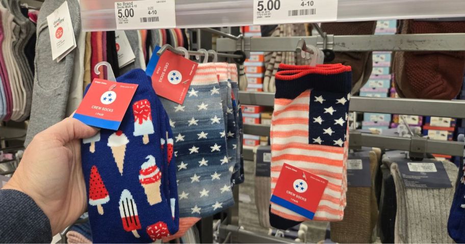 A person showing 4th of July socks at Target