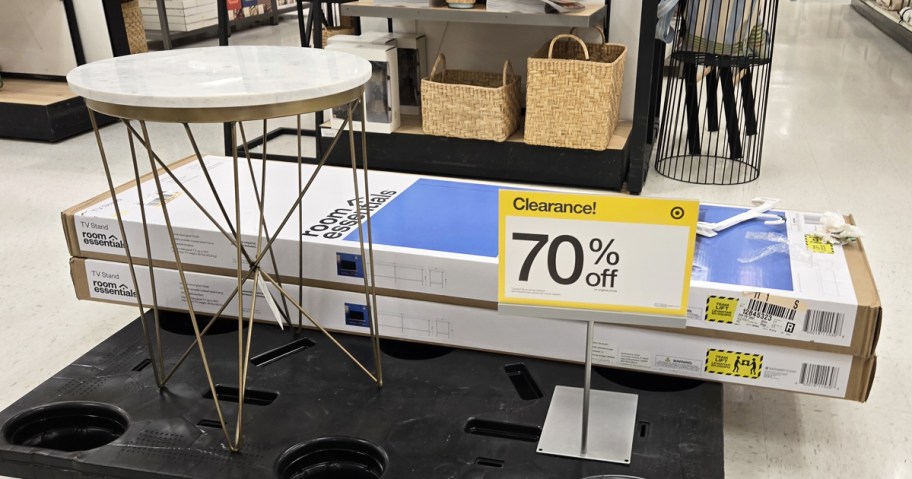 furniture on black pallet with 70% off clearance sign
