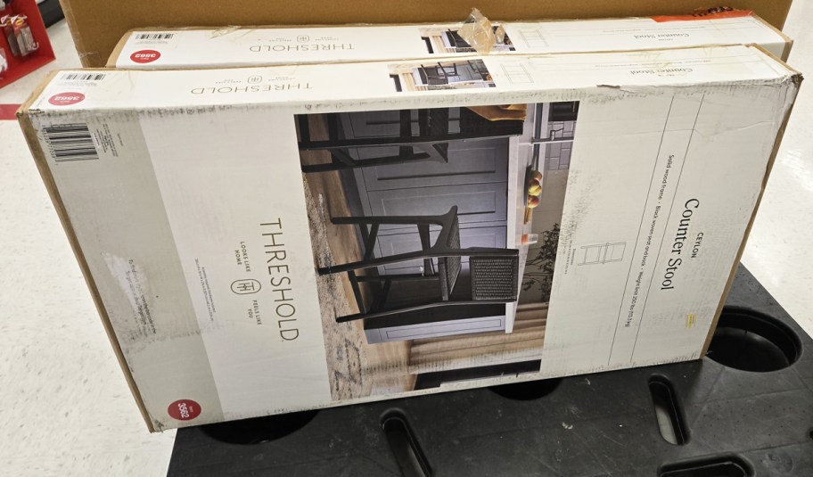 boxes for black counter stools on pallet in store
