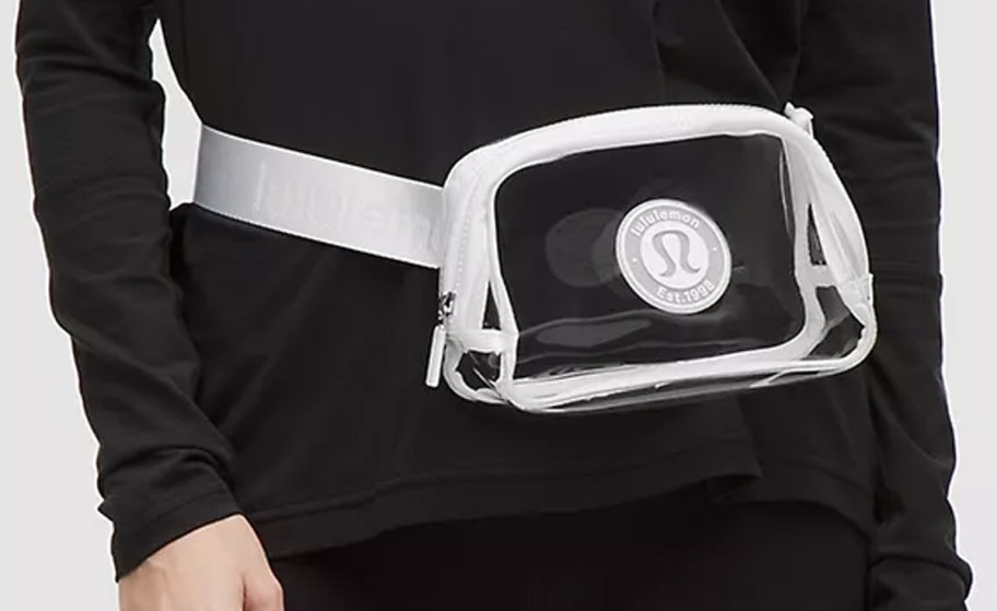 Woman wearing lululemon Everywhere Belt Bag 1L in Clear