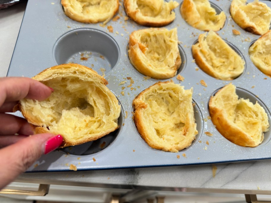 adding croissant to a muffin cup