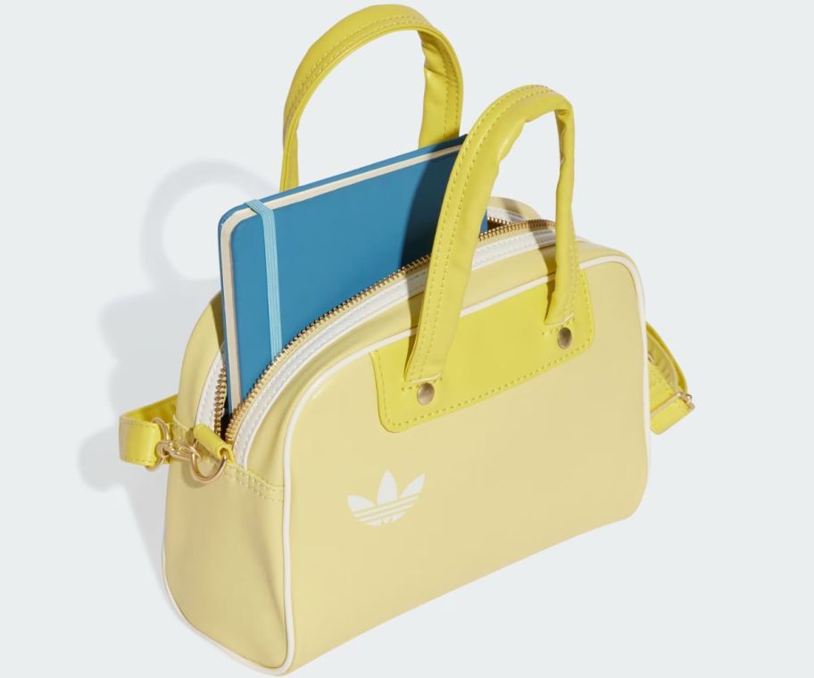 a yellow adidas bowling-style bag