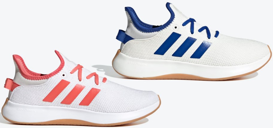 two white sneakers with pink and blue stripes