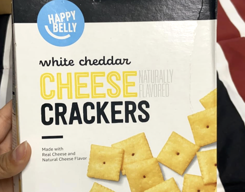 holding cheese crackers box 