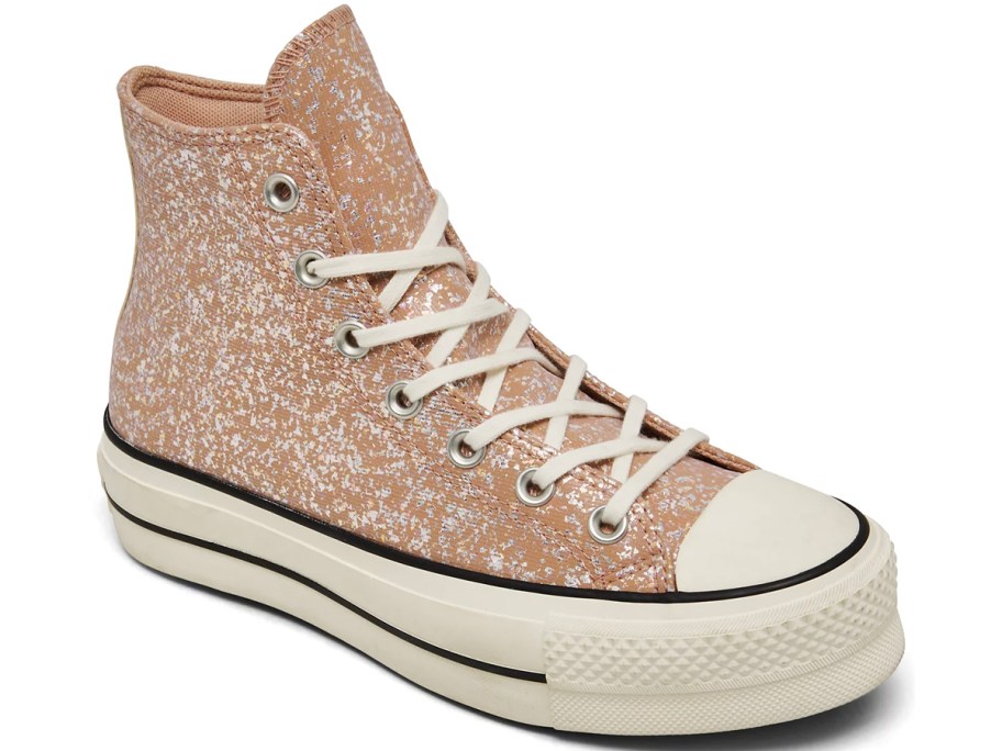 tan and white high top converse shoe