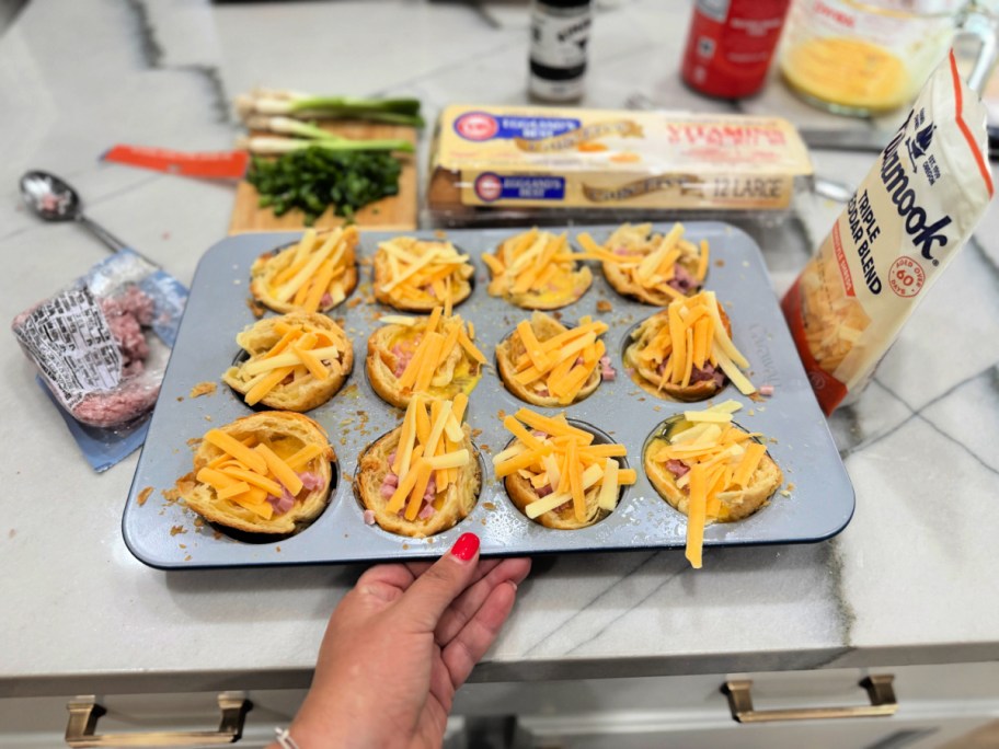 croissant egg cups with cheddar cheese on top 
