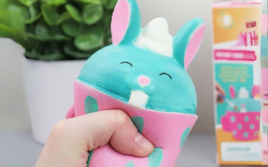 a hand squeezing a bunny squishy
