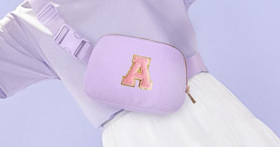 purple color belt bag with initial A on it