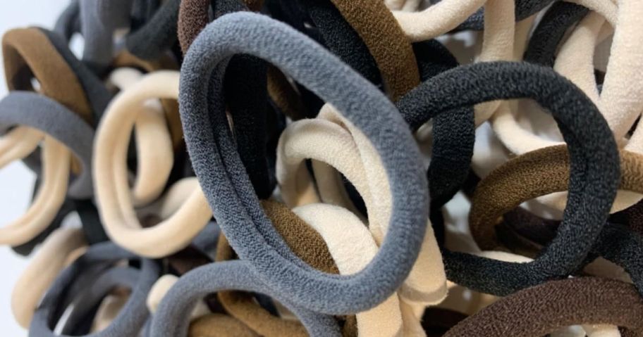 a closeup of Vrose Flosi Seamless No-Damage Hair Ties in blue, black, beige, and brown