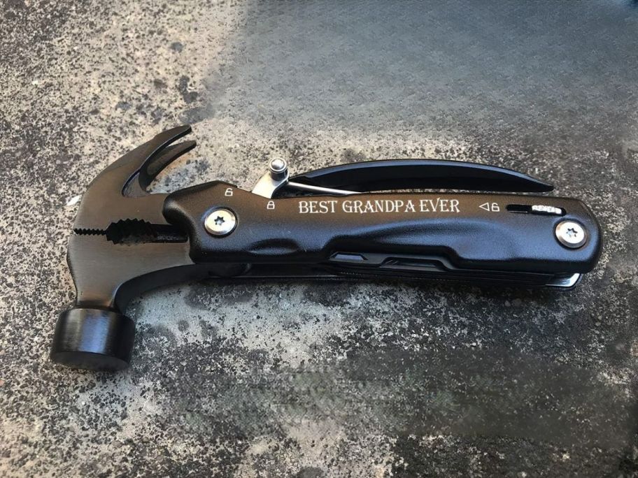 multi hammer tool on table with "best grandpa ever" written on it