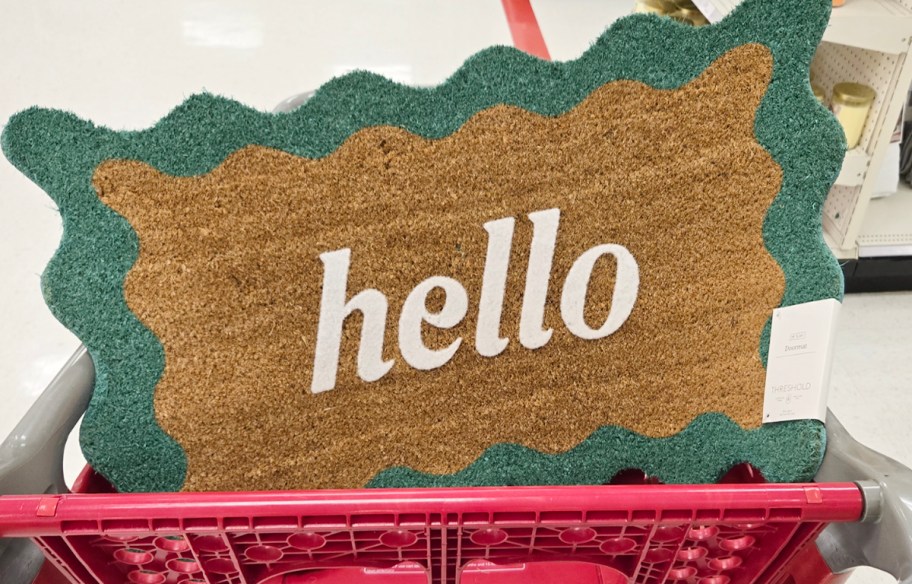coir doormat with wavy sides that says hello