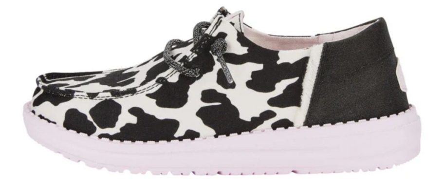 black and white HEYDUDE Big Kids Wendy Funk Youth Cow Shoe stock image