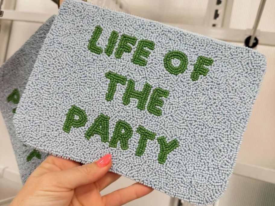 blue and green kate spade new york x Target Life of the Party Beaded Clutch in hand in store