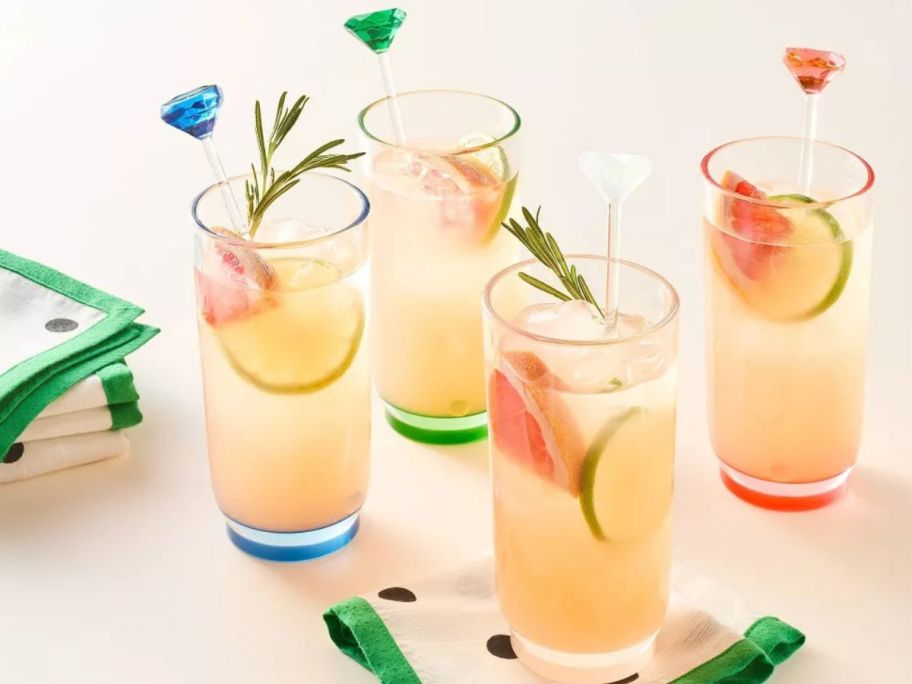 kate spade new york x Target 4-Piece Acrylic Highball Drinkware Set with stir sticks in them