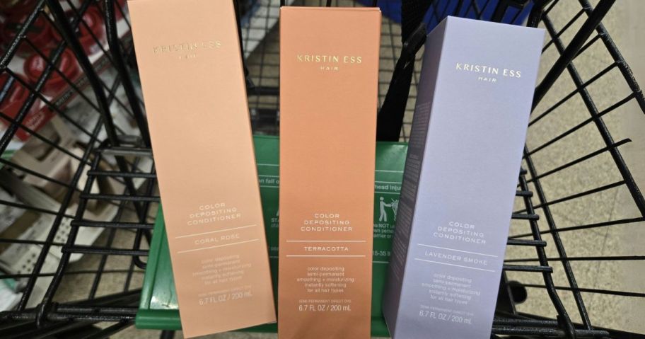Kristin Ess Hair Care Color Depositing Conditioner boxes in cart in store