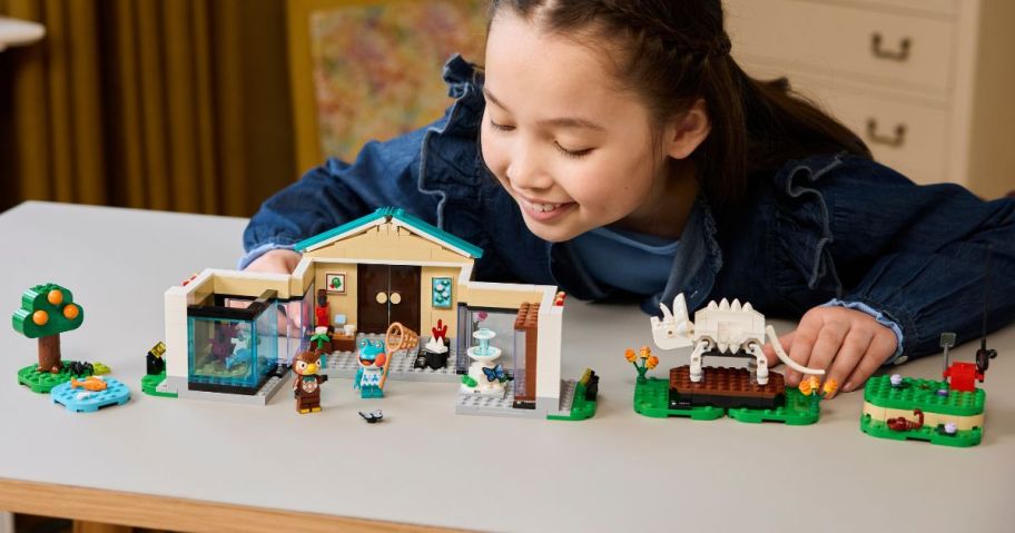 kid playing with LEGO Animal Crossing Blather's Museum Collection
