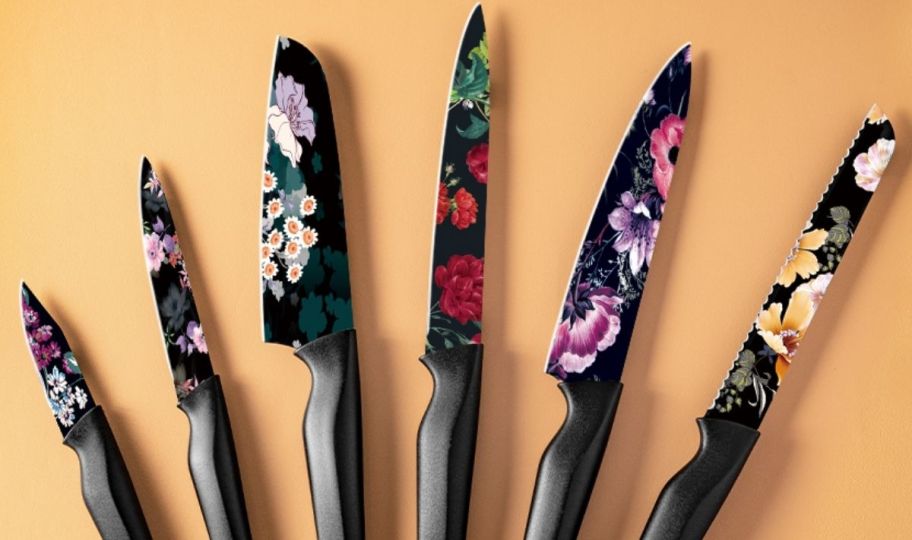 a 12 piece kitchen knife set with various flowers printed on the blades