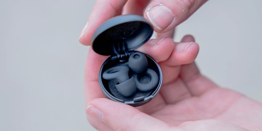 hand holding black loop earplugs