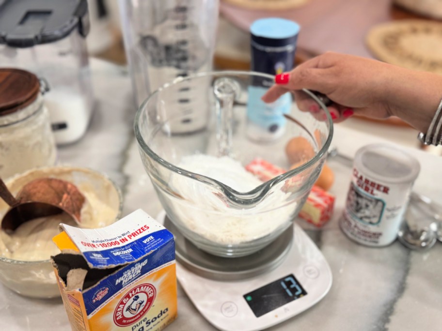 measuring dry ingredients to make sourdough pancakes