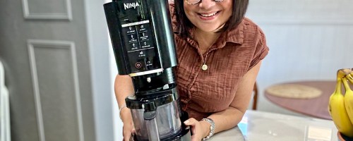 woman holding ninja creami machine
