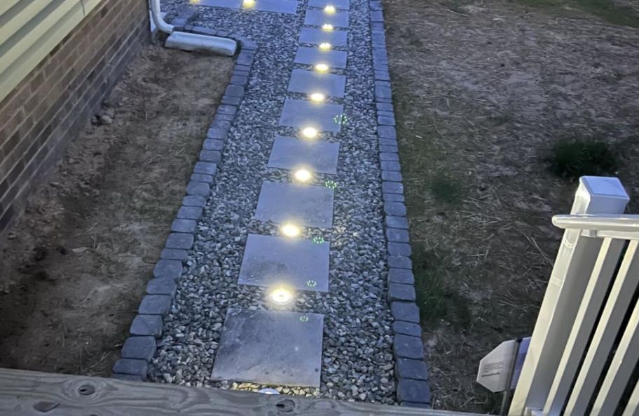solar landscaping lights lighting a pathway of stepping stones