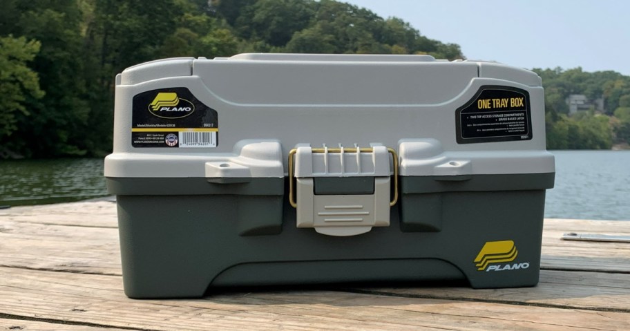 plano tackle box on a picnic table in front of a lake