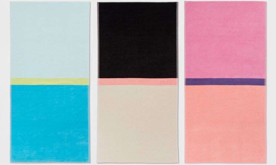 three large color blocked reversible beach towels