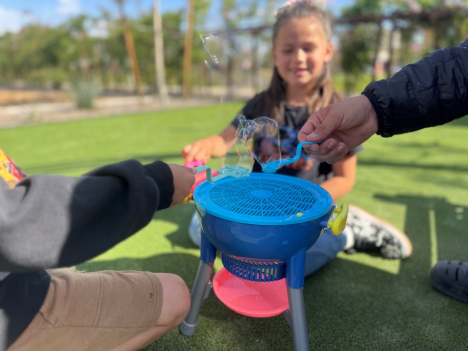 kids playing with a sun squad bubble grill