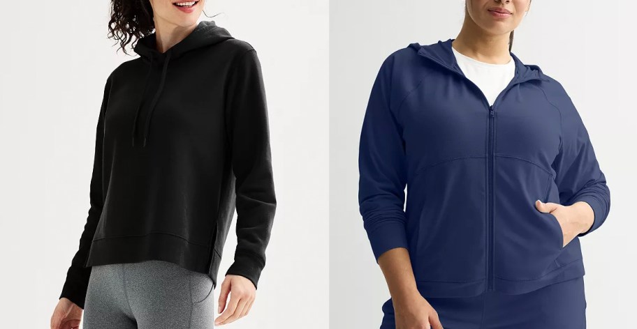 two women wearing black and navy blue hoodies 