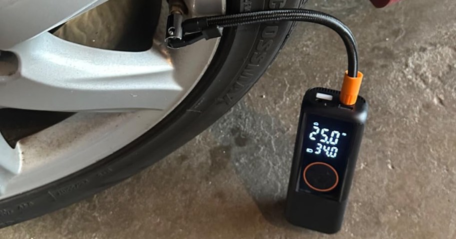 tire inflator putting air into a car tire