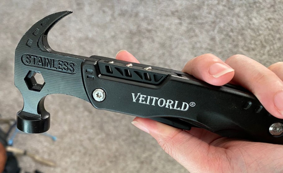 hand holding multitool hammer