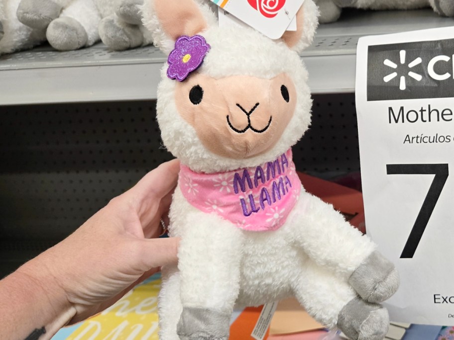 hand holding mama llama plush