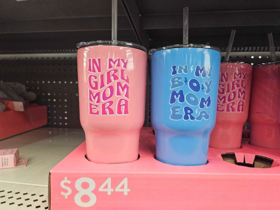 a pink and blue Way To Celebrate Stainless Steel Tumbler on shelf in store
