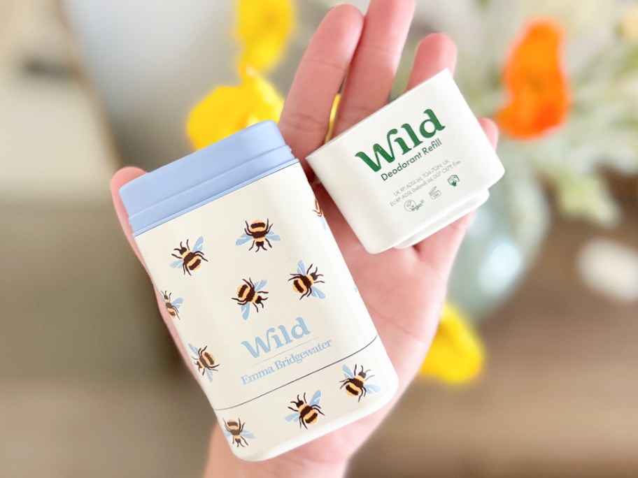 hand holding a Wild Deodorant case with refill
