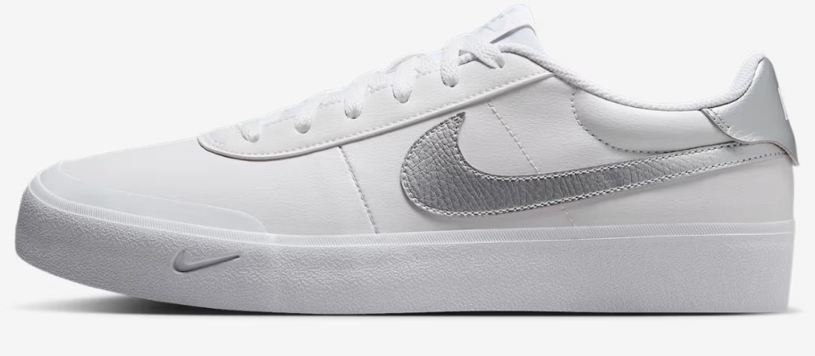 a men's Nike court shoe in white with grey accents