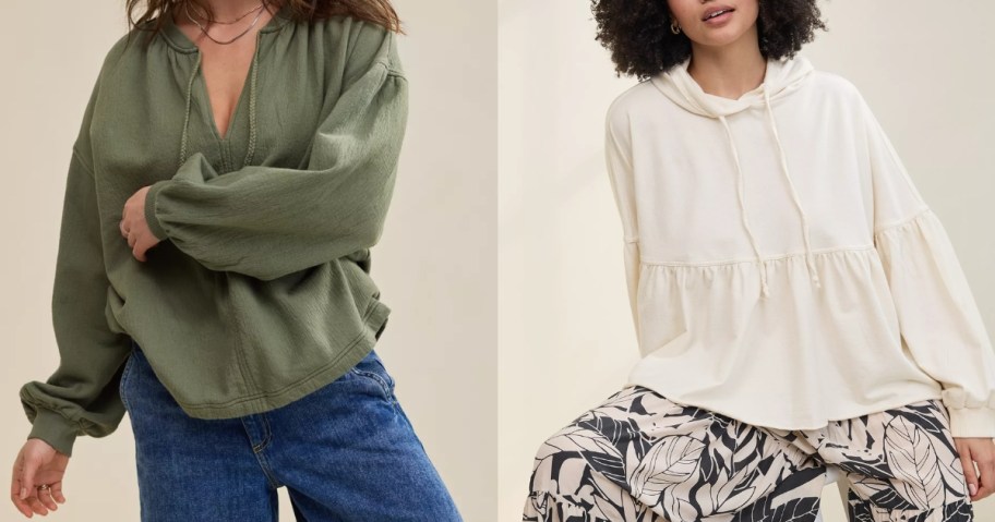 2 women wearing oversized flowy sweatshirts