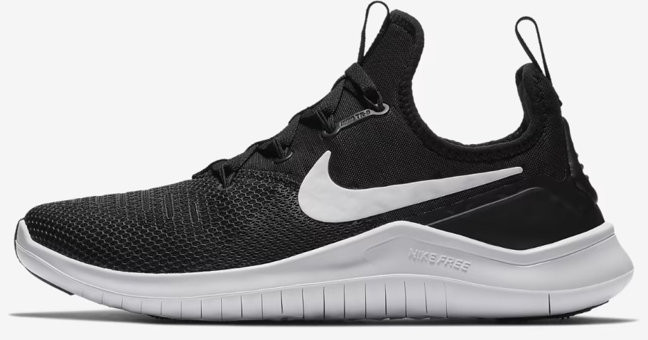 a women's Nike running shoe in black and white