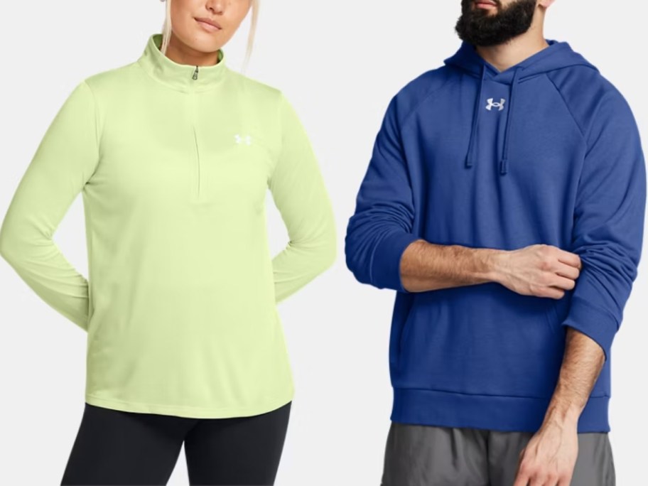 woman wearing a yellow quarter zip top and man wearing a blue hoodie