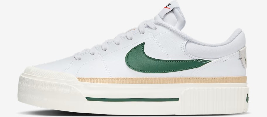 a women's Nike court platform shoe in white with green and yellow accents