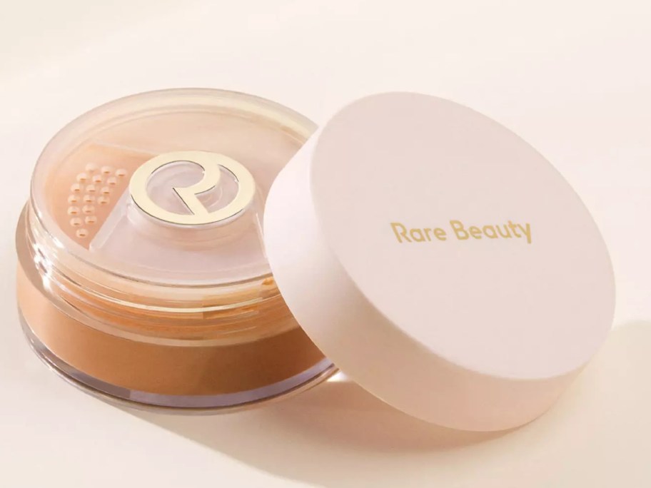 an open container of makeup setting powder