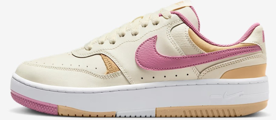 a women's Nike shoe in off white, pink, and tan