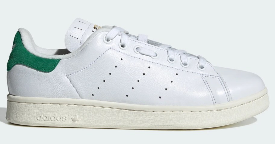 a white and green men's adidas shoe